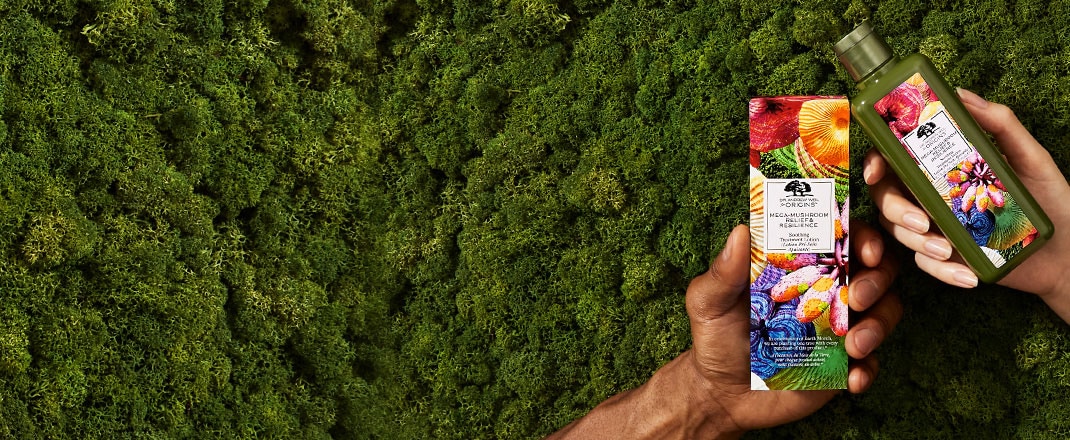 green background with hands holding products
