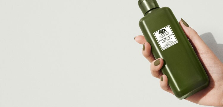 hand holding Mega-Mushroom treatment lotion