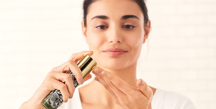 woman applying serum